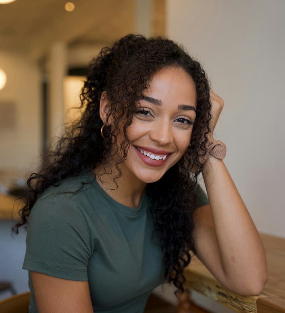 Woman smiling with relief after her medical bill was reduced